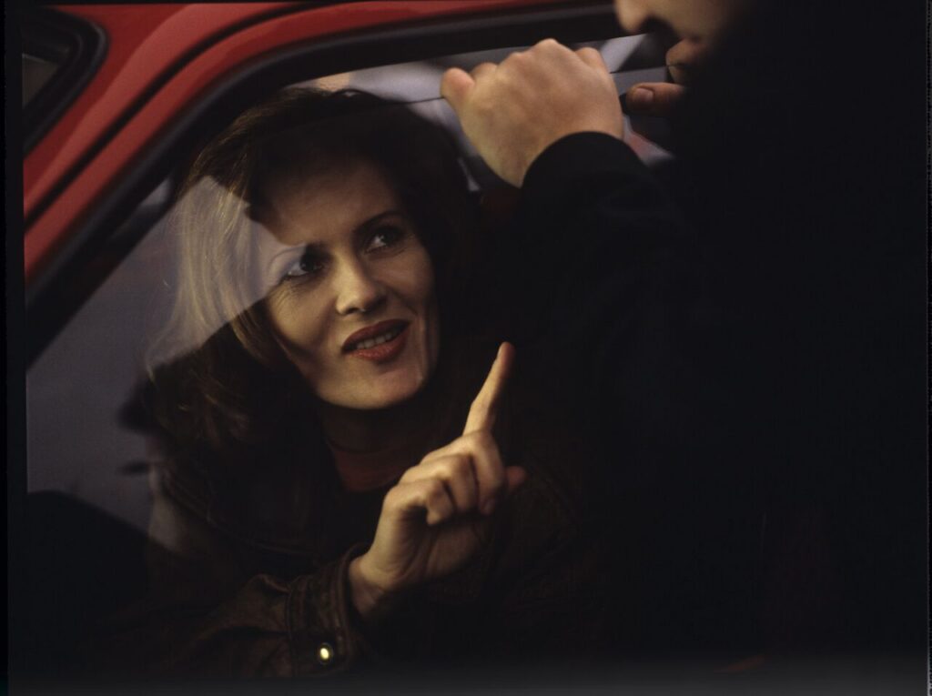 "Blonde" (Grażyna Szapołowska) in the car that Karol stopped. The scene did not appear in the movie.