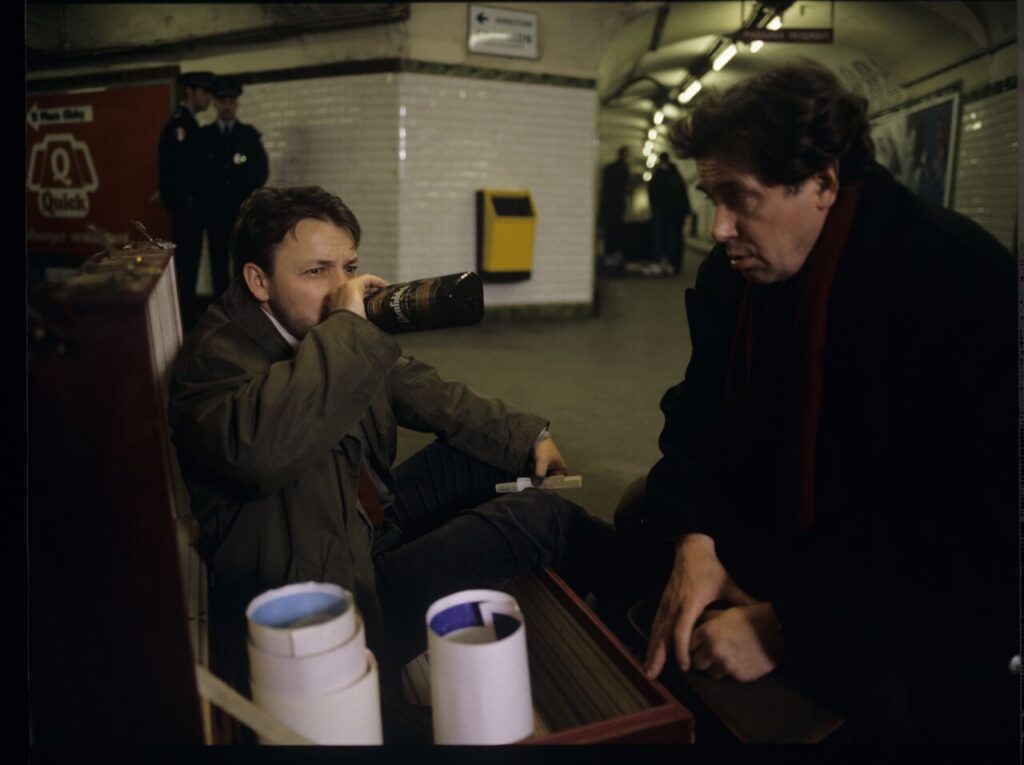 Karol (Zbigniew Zamachowski) and Mikołaj (Janusz Gajos) drink Bruderszaft on the Paris metro.