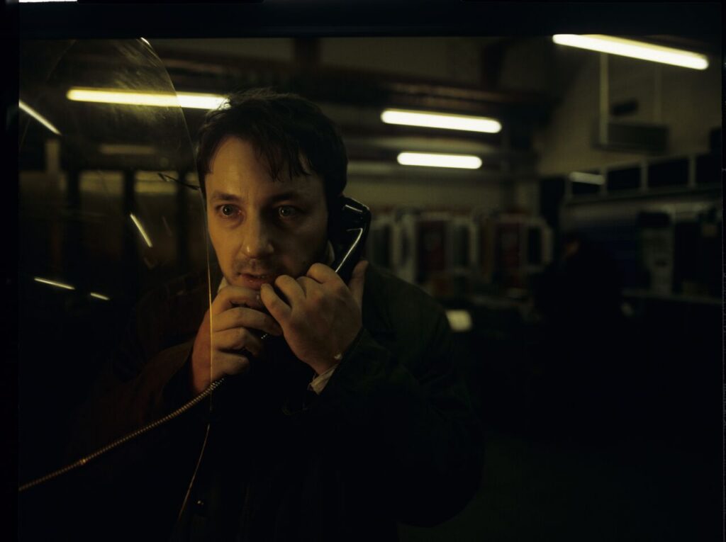 Karol (Zbigniew Zamachowski) calls his wife Dominique and hears her with another man.