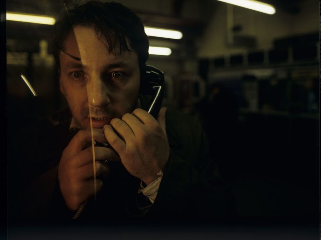 Karol (Zbigniew Zamachowski) calls his wife Dominique and hears her with another man.