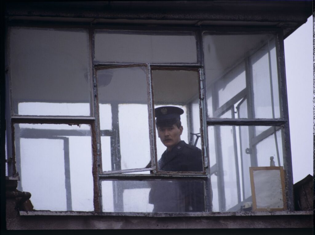 A guard in the watchtower of the prison where Karol's wife, Dominique, is serving her sentence.