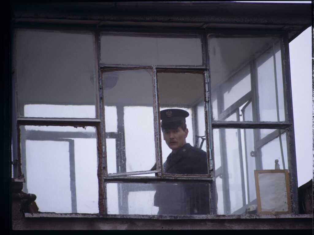 A guard in the watchtower of the prison where Karol's wife, Dominique, is serving her sentence.