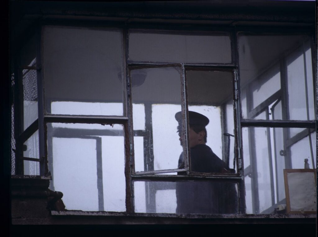A guard in the watchtower of the prison where Karol's wife, Dominique, is serving her sentence.