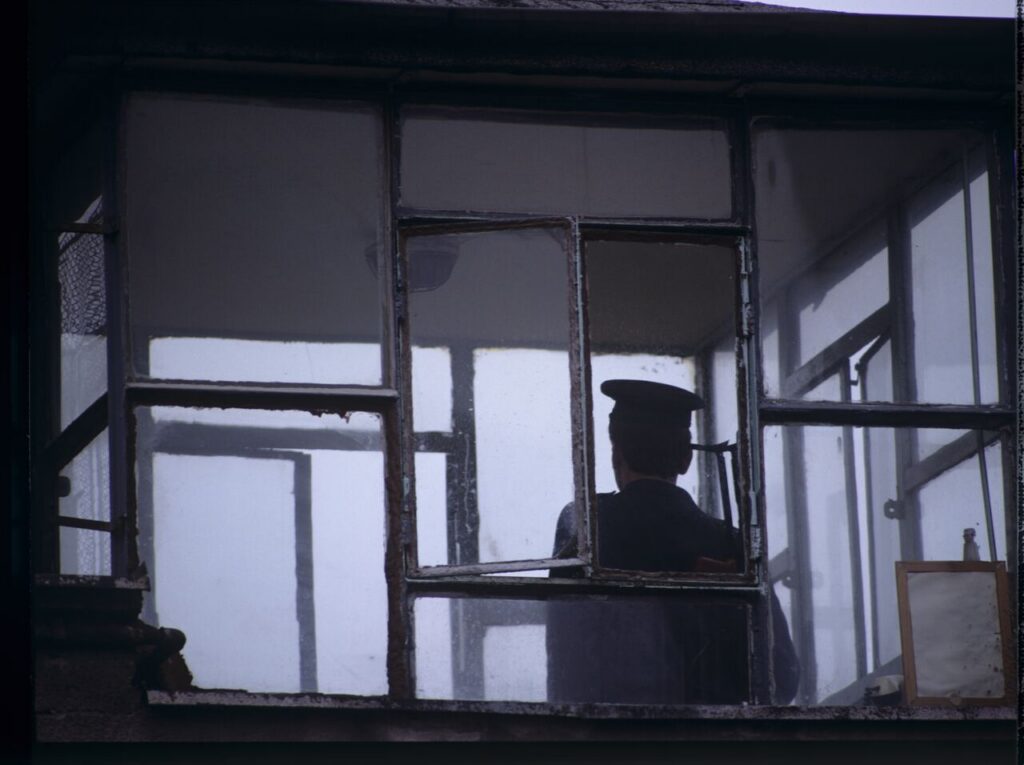 A guard in the watchtower of the prison where Karol's wife, Dominique, is serving her sentence.