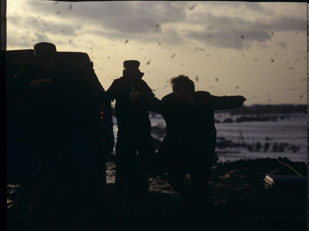 Shooting a scene at a garbage dump where airport luggage thieves bring a suitcase containing Karol.