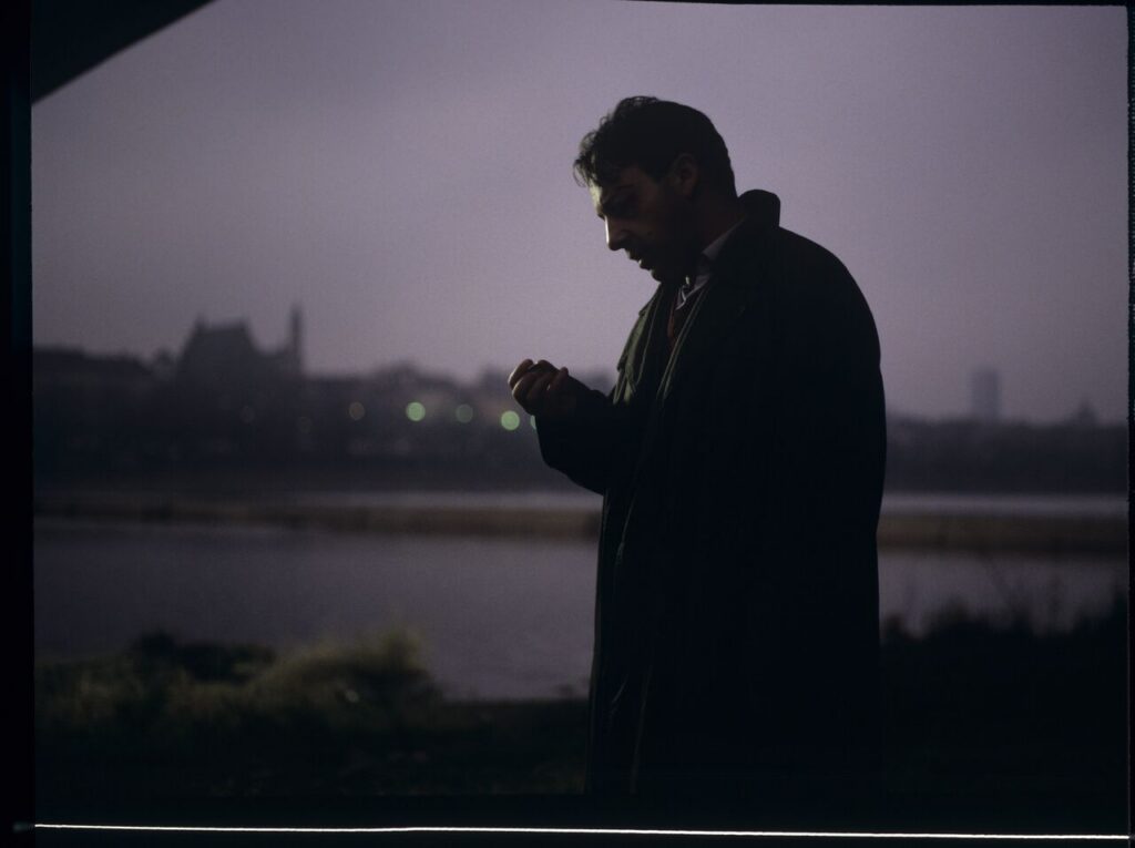 Karol (Zbigniew Zamachowski) with his talisman - a two-franc coin brought from France.