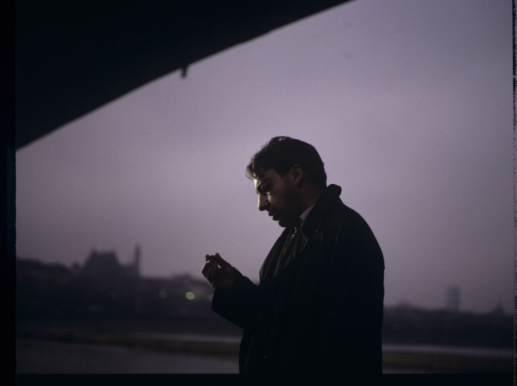 Karol (Zbigniew Zamachowski) with his talisman - a two-franc coin brought from France.