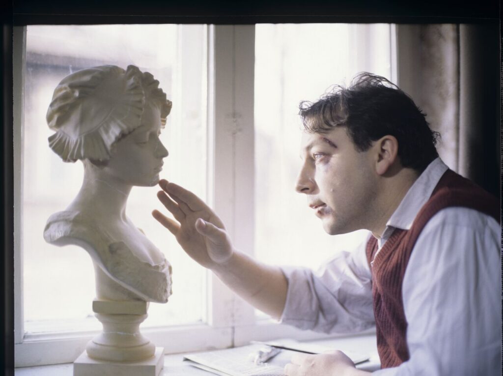 Karol (Zbigniew Zamachowski) stares at the plaster bust of a woman brought from Paris.