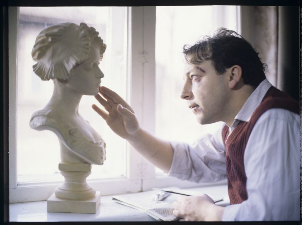 Karol (Zbigniew Zamachowski) stares at the plaster bust of a woman brought from Paris.