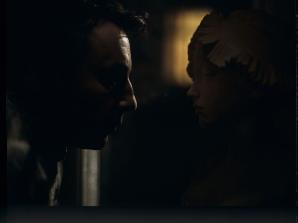 Karol (Zbigniew Zamachowski) stares at the plaster bust of a woman brought from Paris.