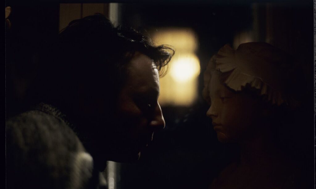 Karol (Zbigniew Zamachowski) stares at the plaster bust of a woman brought from Paris.