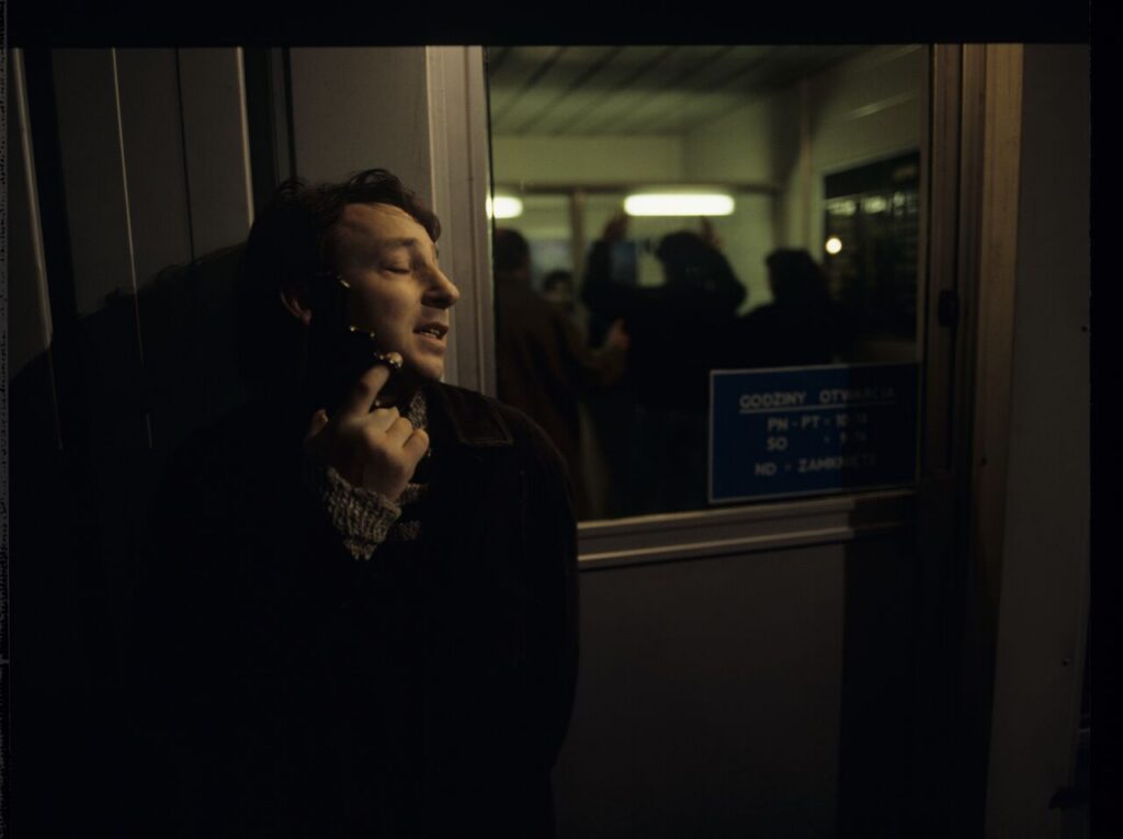 Karol (Zamachowski) as a security guard during a robbery at a currency exchange office. The scene did not appear in the film.