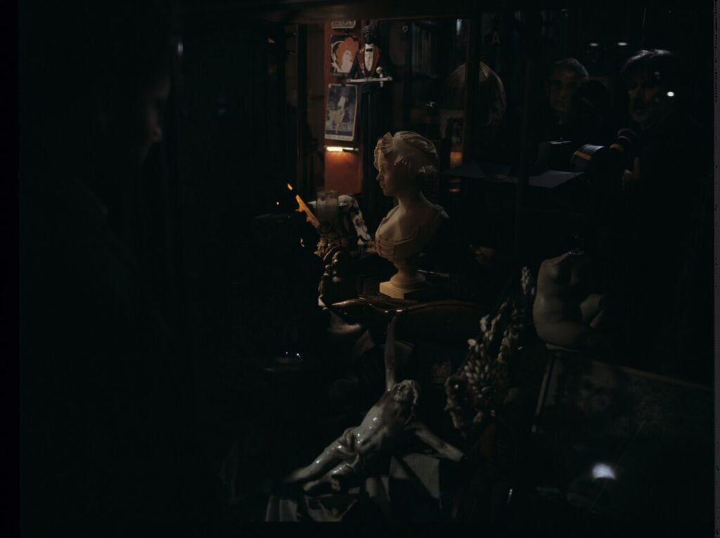 A view of the window of an antique shop, where Karol's attention was caught by the sight of an alabaster bust of a woman.
