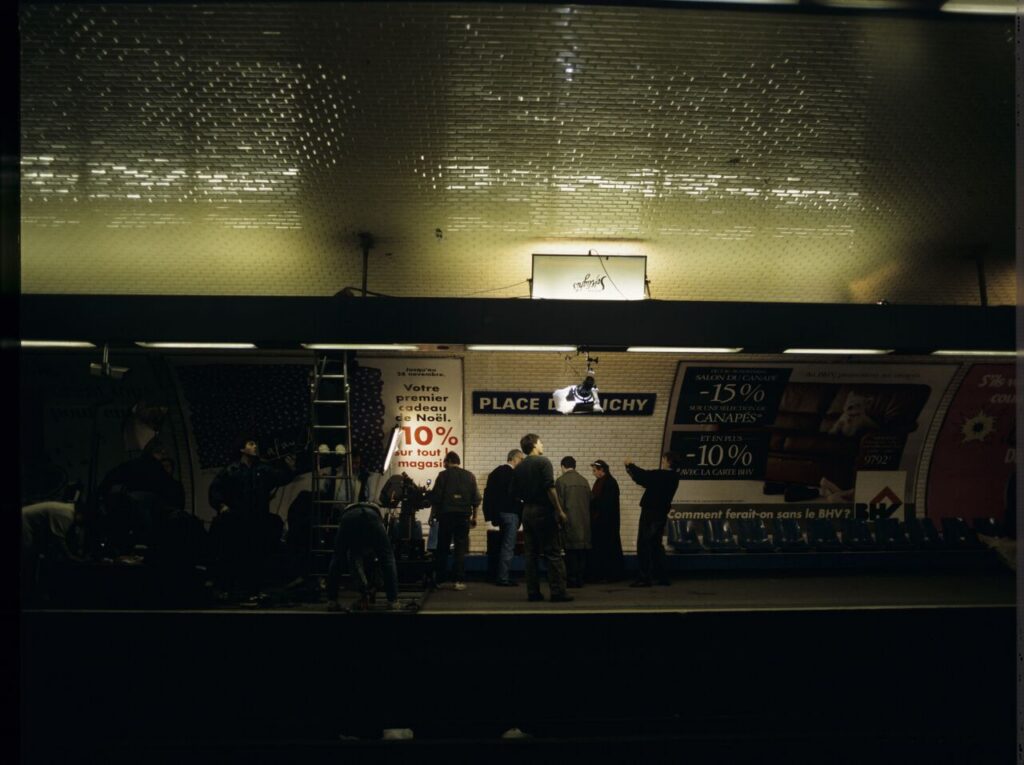 The crew on set on a Paris metro platform.