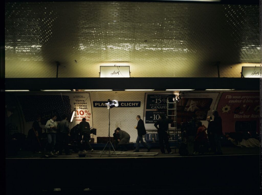 The crew on set on a Paris metro platform.
