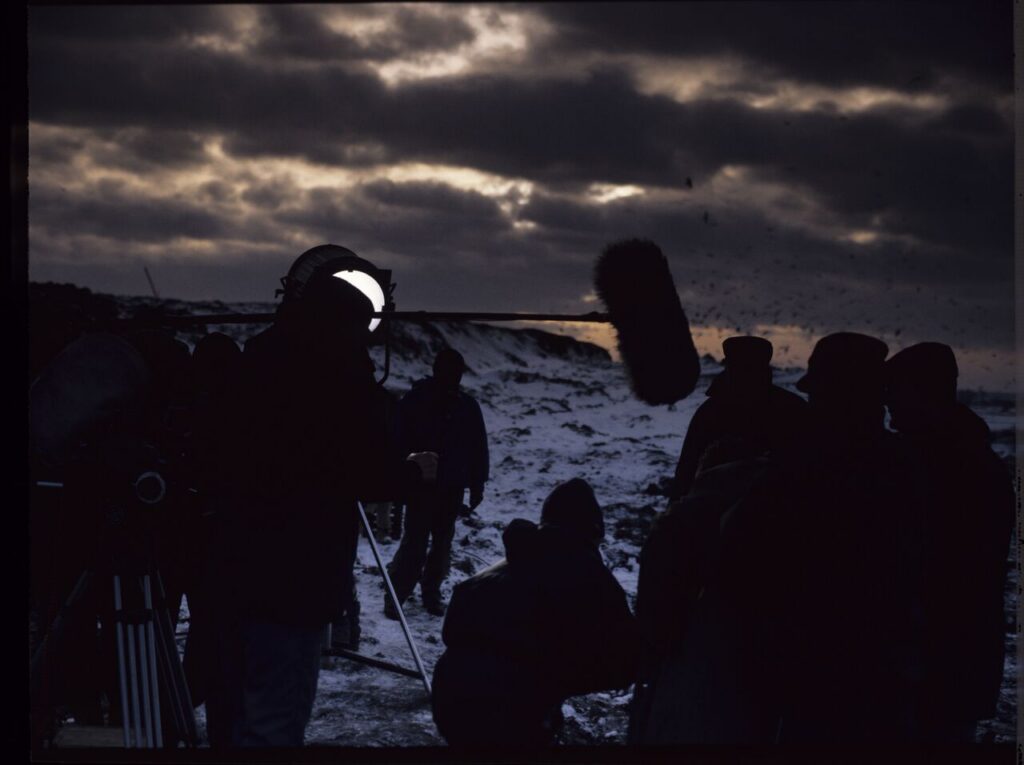The crew on set at a garbage dump.