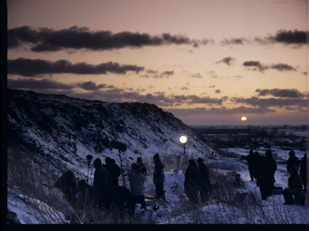 The crew on set at a garbage dump.
