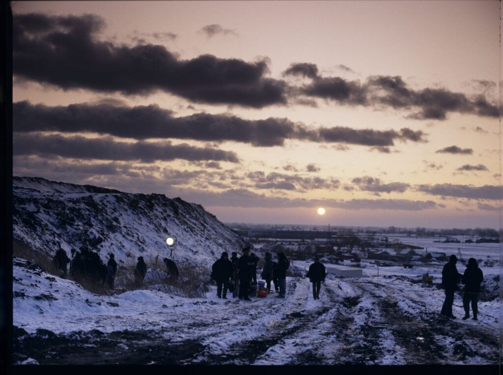 The crew on set at a garbage dump.