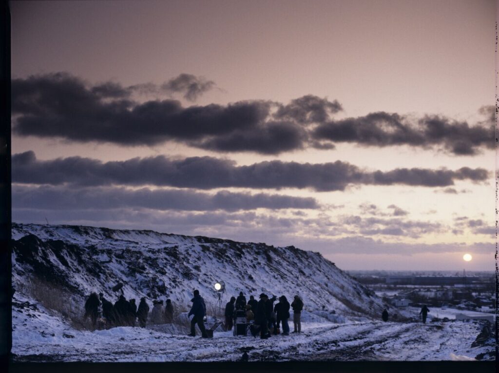 The crew on set at a garbage dump.