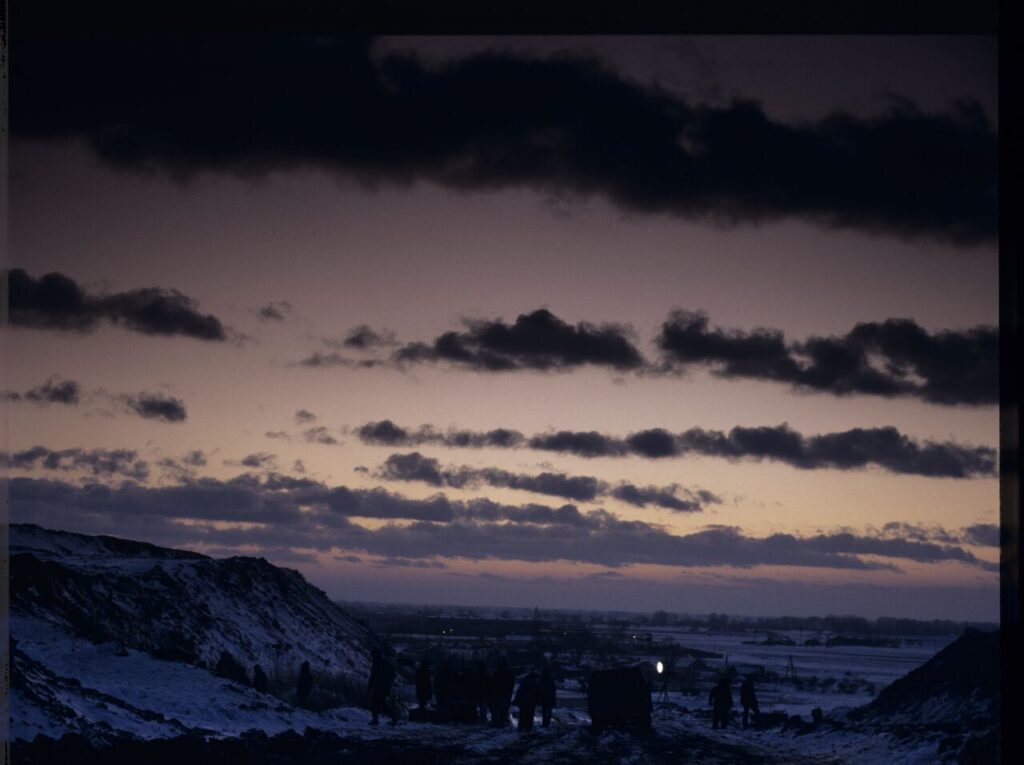 The crew on set at a garbage dump.