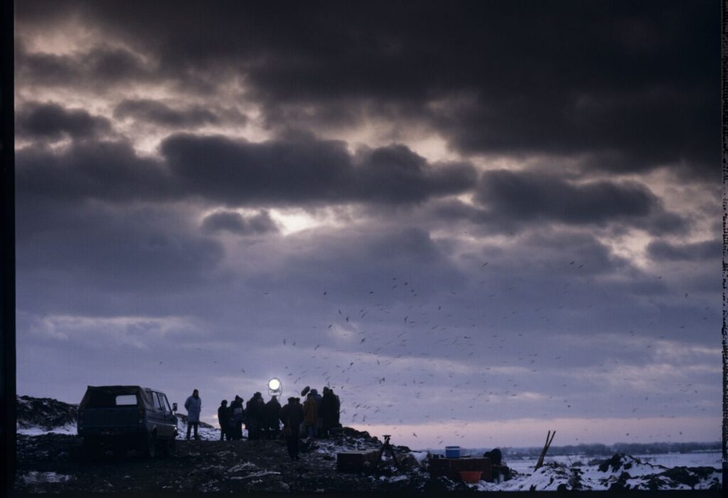 The crew on set at a garbage dump.