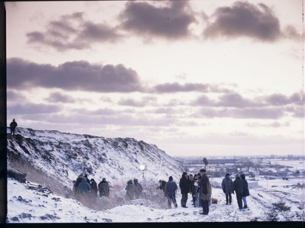 The crew on set at a garbage dump.