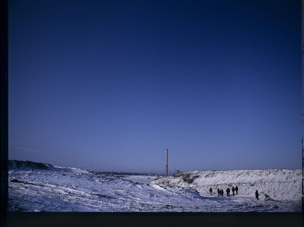 The crew on set at a garbage dump.