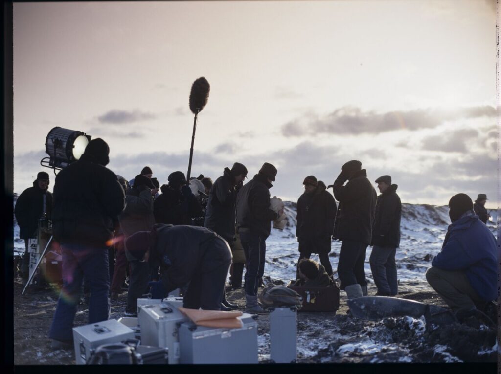 The crew on set at a garbage dump.