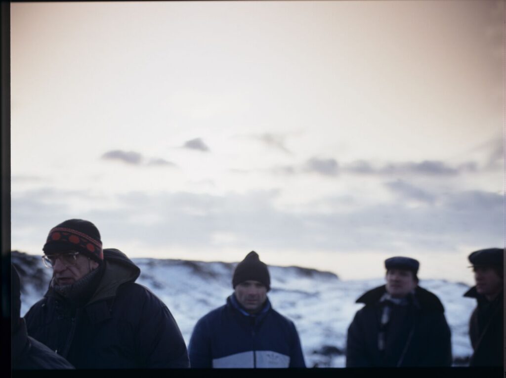 The crew on set at a garbage dump.