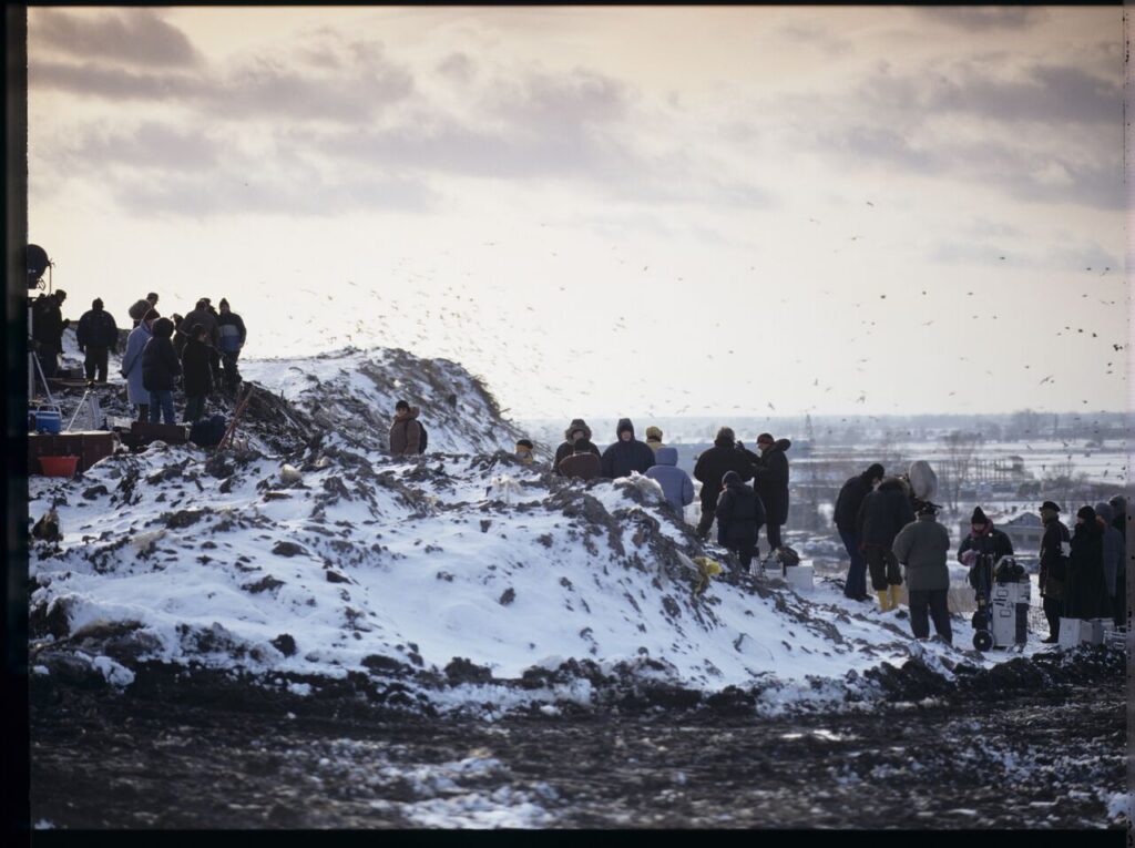 The crew on set at a garbage dump.