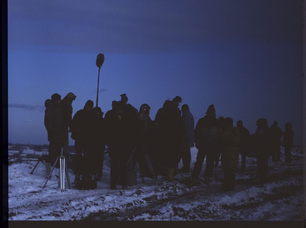 The crew on set at a garbage dump.
