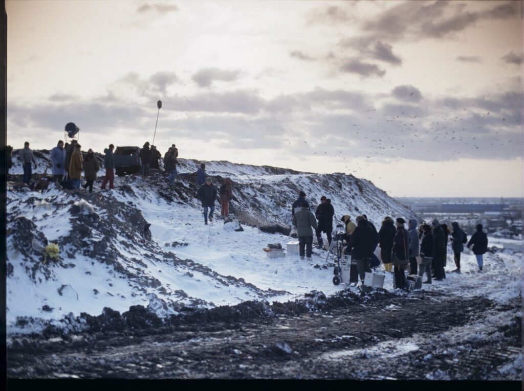 The crew on set at a garbage dump.