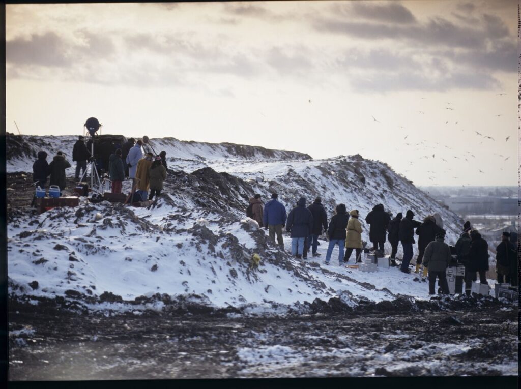 The crew on set at a garbage dump.