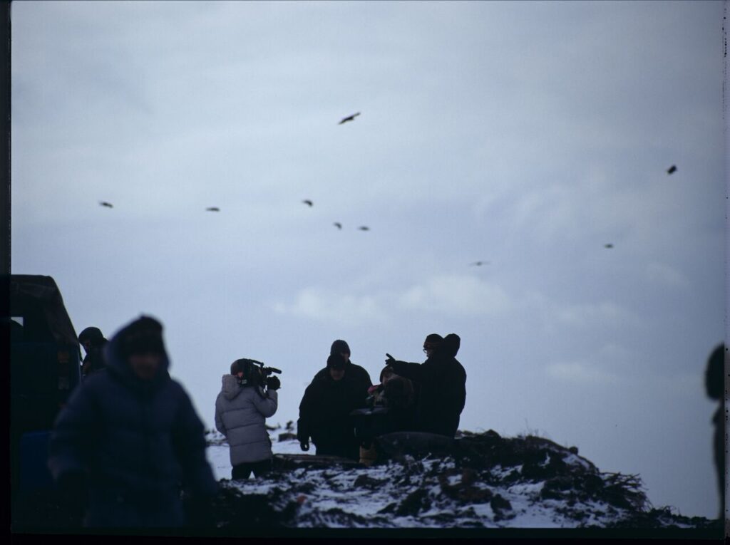 The crew on set at a garbage dump.