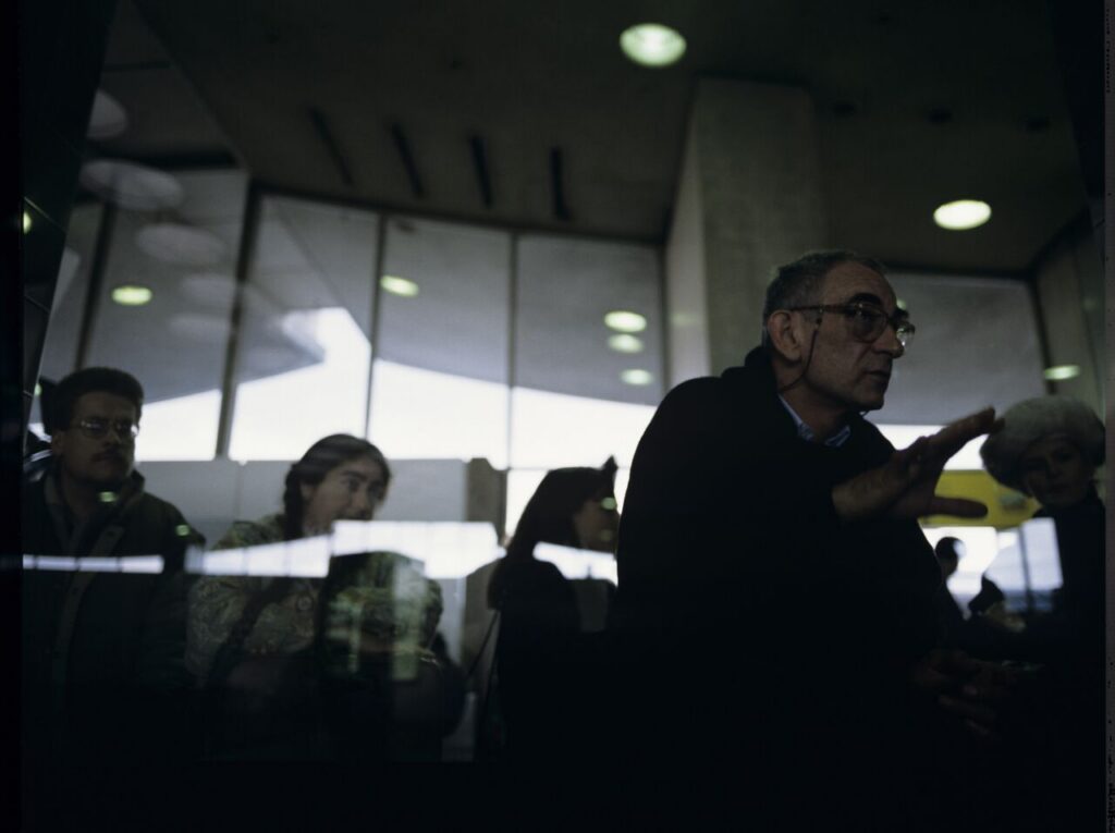 Krzysztof Kieślowski (director) on the set at the airport in Warsaw.