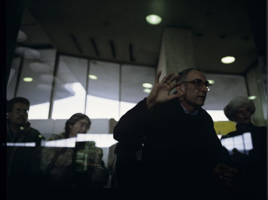 Krzysztof Kieślowski (director) on the set at the airport in Warsaw.