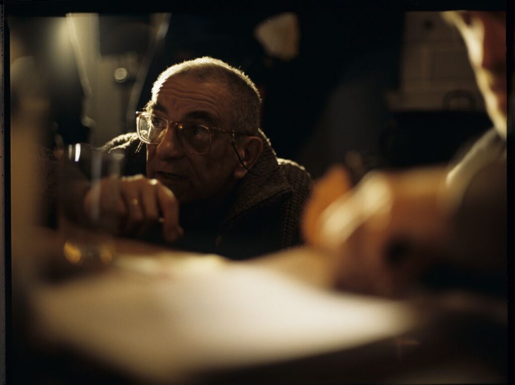 Krzysztof Kieślowski (director) on the set in the house of the farmer from whom Karol bought the land.
