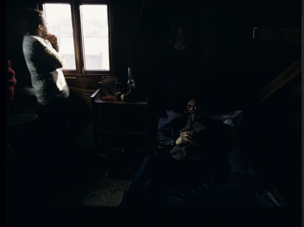 Krzysztof Kieślowski (director) and others on the set in the house of the farmer from whom Karol bought the land.