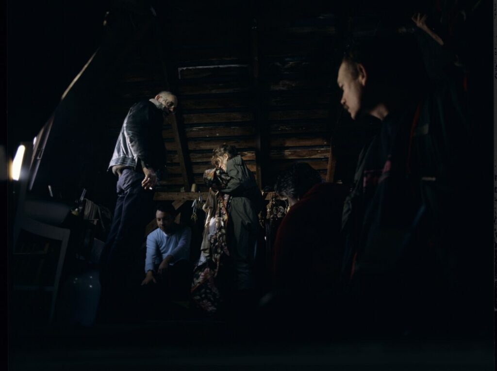 The crew on set at the home of the farmer from whom Karol bought the land.