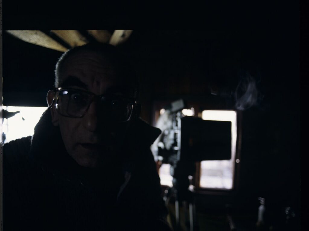 Krzysztof Kieślowski (director) on the set in the house of the farmer from whom Karol bought the land.