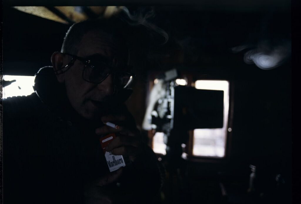 Krzysztof Kieślowski (director) on the set in the house of the farmer from whom Karol bought the land.