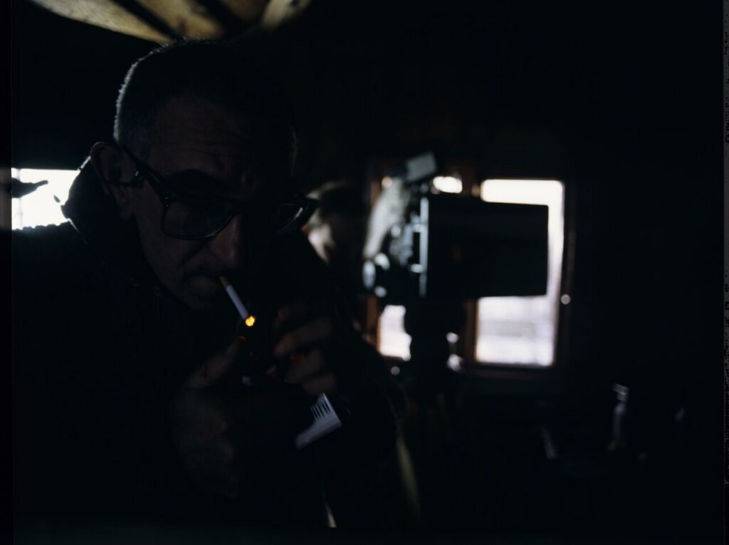Krzysztof Kieślowski (director) on the set in the house of the farmer from whom Karol bought the land.
