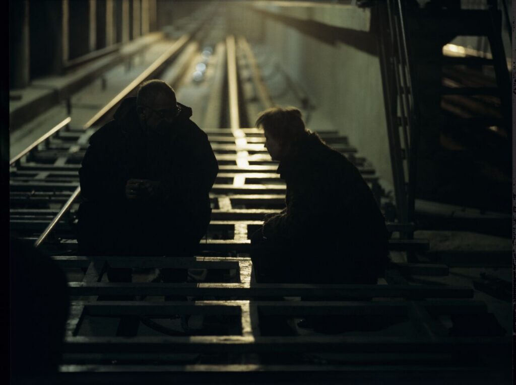 K. Kieślowski (director) and V. Buhl (co-director) on the set in the basement of the Warsaw metro under construction.