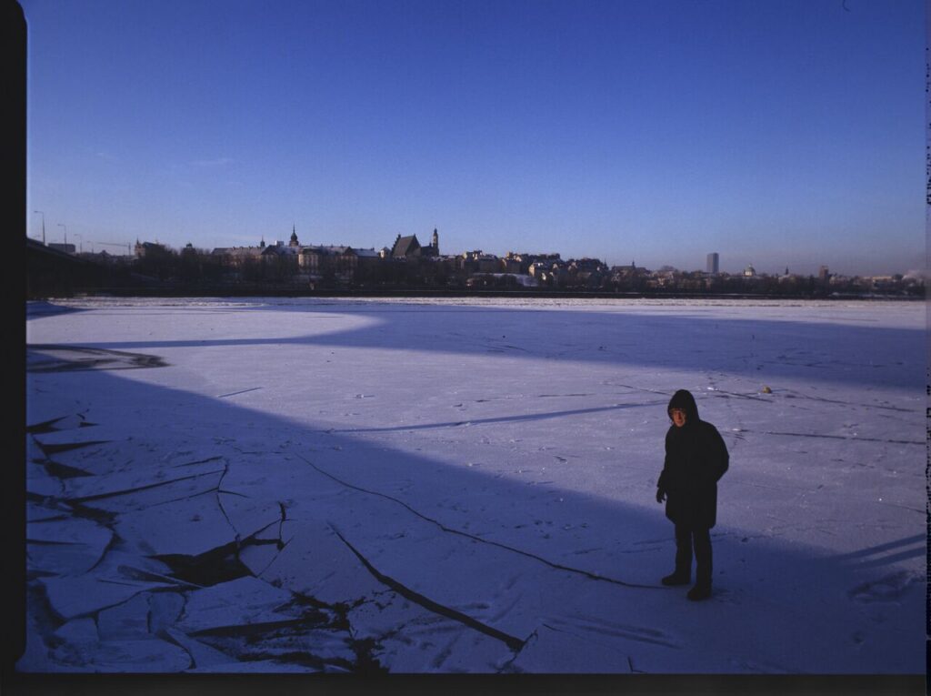 Krzysztof Kieślowski (director) on the frozen Vistula River, where the scene of the sliding will be filmed.