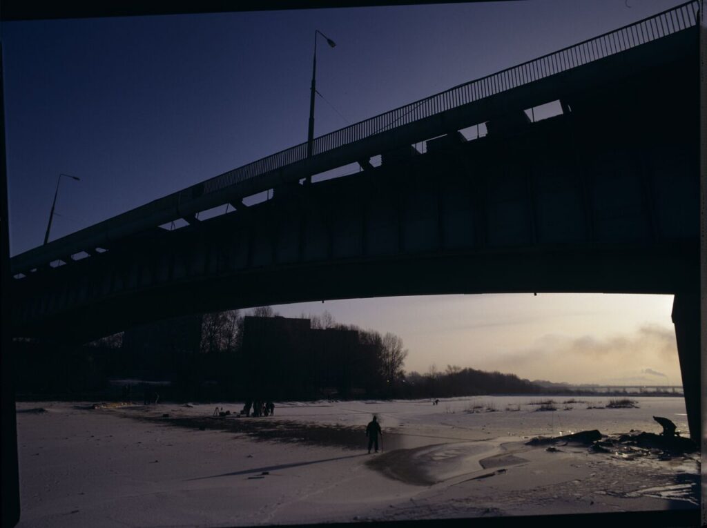 Krzysztof Kieślowski (director) on the frozen Vistula River, where the scene of the sliding will be filmed.