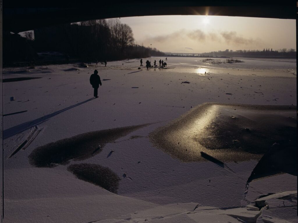 Krzysztof Kieślowski (director) on the frozen Vistula River, where the scene of the sliding will be filmed.