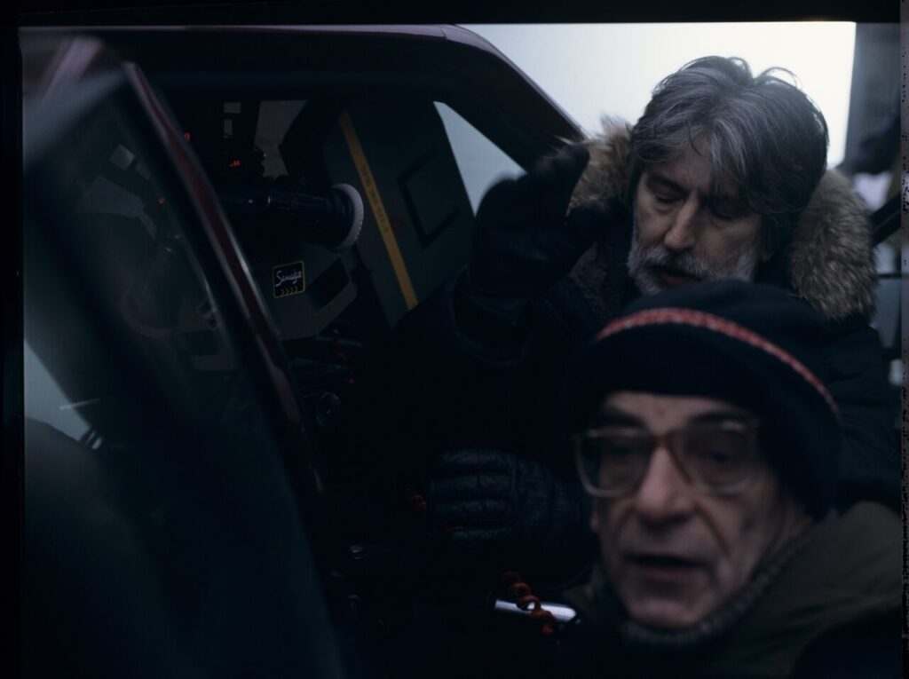 Krzysztof KIeślowski (director) and Edward Kłosiński (cinematographer) on the set next to Karol's car.
