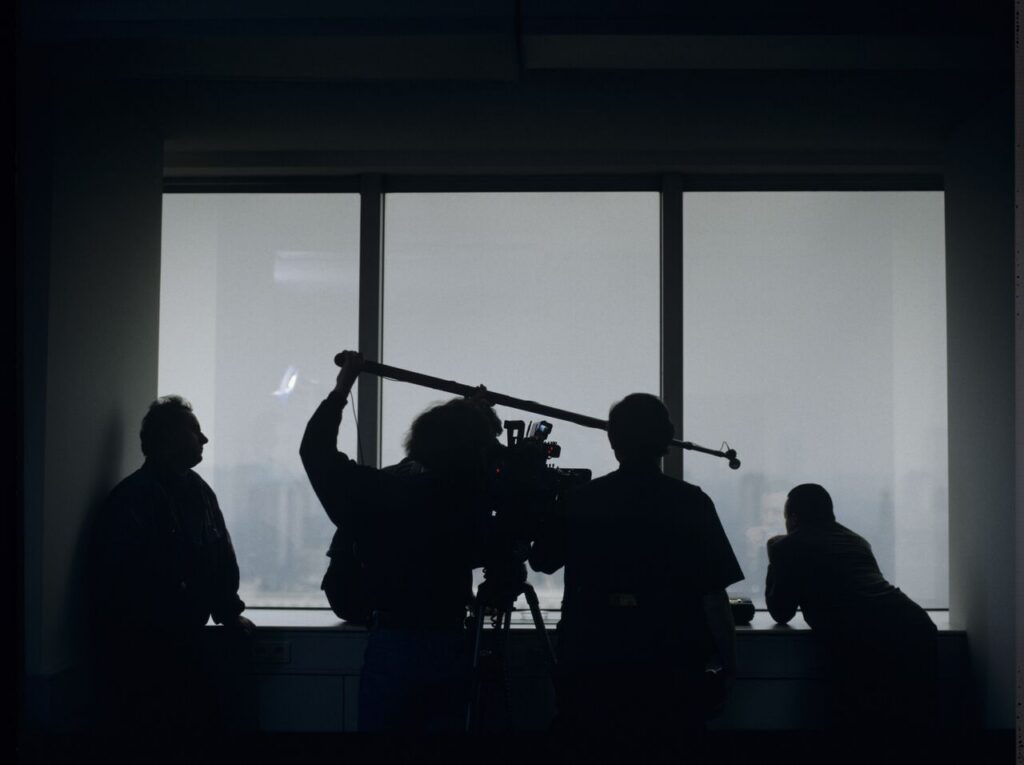 Preparations for filming a scene in Karol's new office at the Mariott Hotel.
