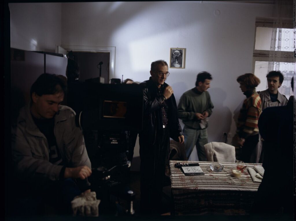 Preparing for work on the set. Pictured: director Krzysztof Kieślowski surrounded by the crew.