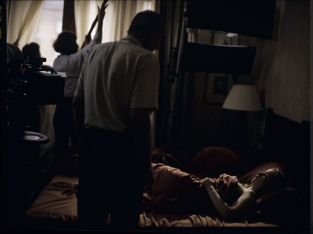 Filming the scene where Dominique wakes up in a hotel room after spending the night with Karol after his supposed funeral.